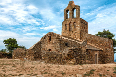 Low angle view of old building against sky