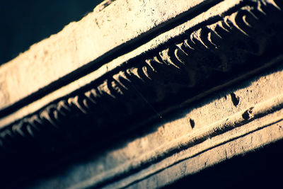 Close-up of text on old metal