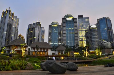 Buildings in city at dusk