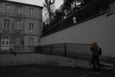 Rear view of woman walking on street