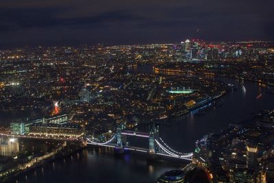 High angle view of illuminated bridge over river at night