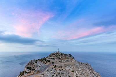 Scenic view of sea and building against sky