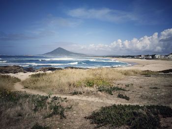 Scenic view of beach against sky