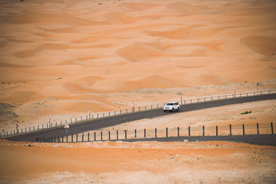 View of car moving on desert