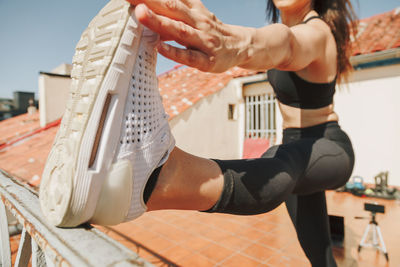 Low section of woman exercising in gym