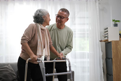 Side view of man working at home