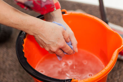 Close-up of hand washing clothes