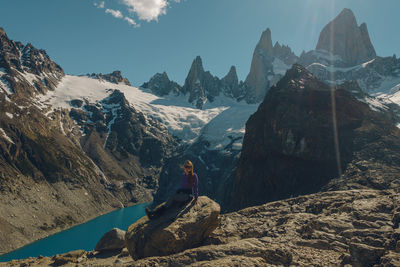 Rear view of man standing on mountain