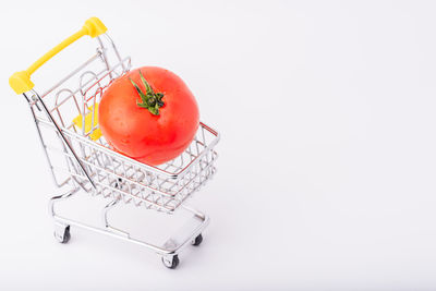 High angle view of tomatoes over white background