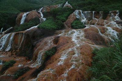 High angle view of waterfall through rocks