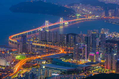 High angle view of illuminated city buildings at night