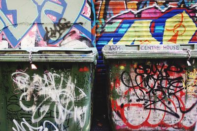 Two dumpster covered in graffiti. in melbourne, australia