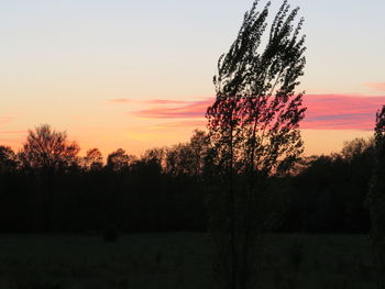 Scenic view of landscape against sky at sunset