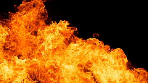 Close-up of fire against black background