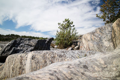 Scenic view of rocky mountains against cloudy sky