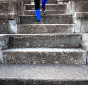 Low section of woman standing on steps