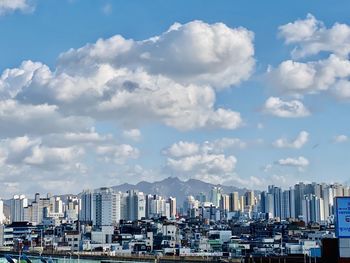 Buildings in city against sky