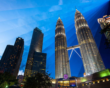 Low angle view of modern building against blue sky