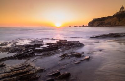 Scenic view of sea against sky during sunset