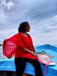 This pic depicts a woman enjoying the beautiful view of the sea