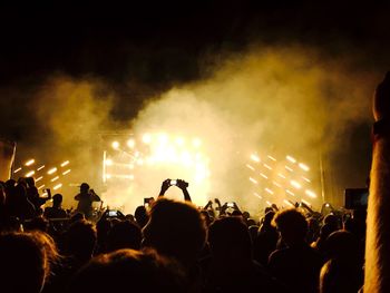 People enjoying music concert