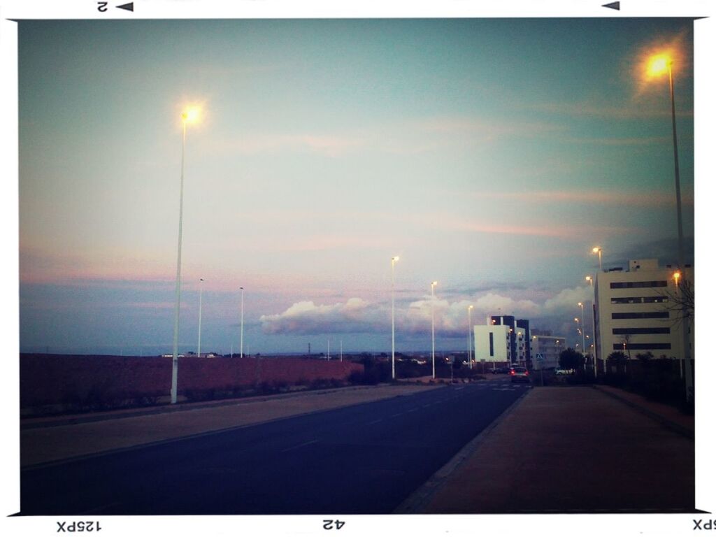 road, the way forward, street light, transfer print, sky, road marking, transportation, illuminated, building exterior, street, auto post production filter, diminishing perspective, city, night, architecture, built structure, vanishing point, lighting equipment, sunset, empty