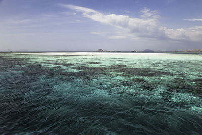 Travel escape concept in tropical atoll island pacific ocean turquoise blue water, komodo, indonesia