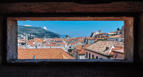 Houses in town against clear sky