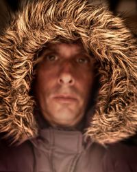 Close-up portrait of man with woman in winter