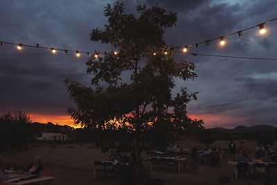 Silhouette of trees against sky at dusk