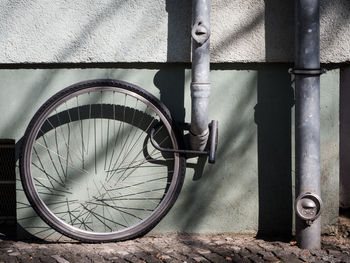 Close-up of bicycle against wall