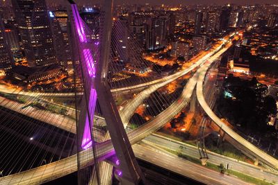 High angle view of light trails on highway at night