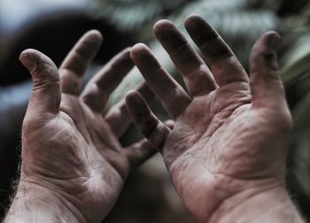 Close-up of mechanic dirty hands