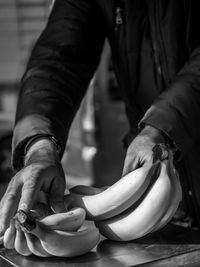 Midsection of man working on table