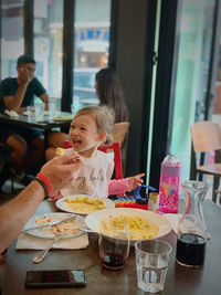 People eating food in restaurant