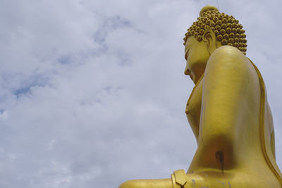 Low angle view of statue against sky