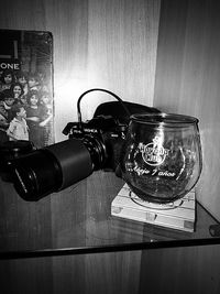 Close-up of illuminated lamp on table at home