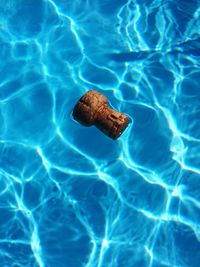 High angle view cork on swimming pool
