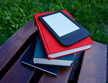 Close-up of books on table outdoors