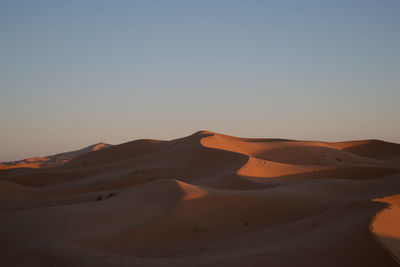 Scenic view of desert against clear sky