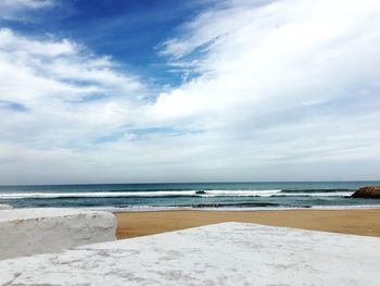 Scenic view of beach against sky