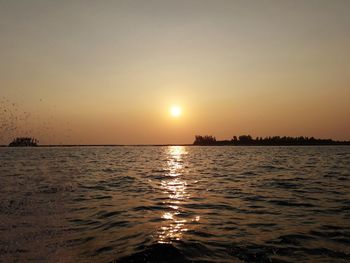 Scenic view of sea against sky during sunset