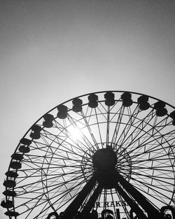 Low angle view of ferris wheel against sky