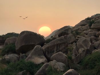 Scenic view of sea against clear sky during sunset