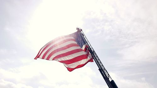 Low angle view of flag against sky