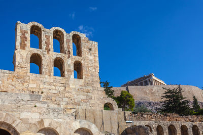 Low angle view of historical building against blue sky