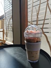 Close-up of ice cream in glass on table