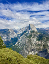 Scenic view of half dome mountains against sky