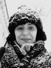 Portrait of young woman in snow