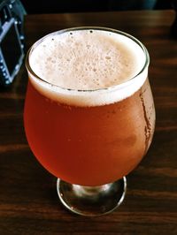 Close-up of beer glass on table